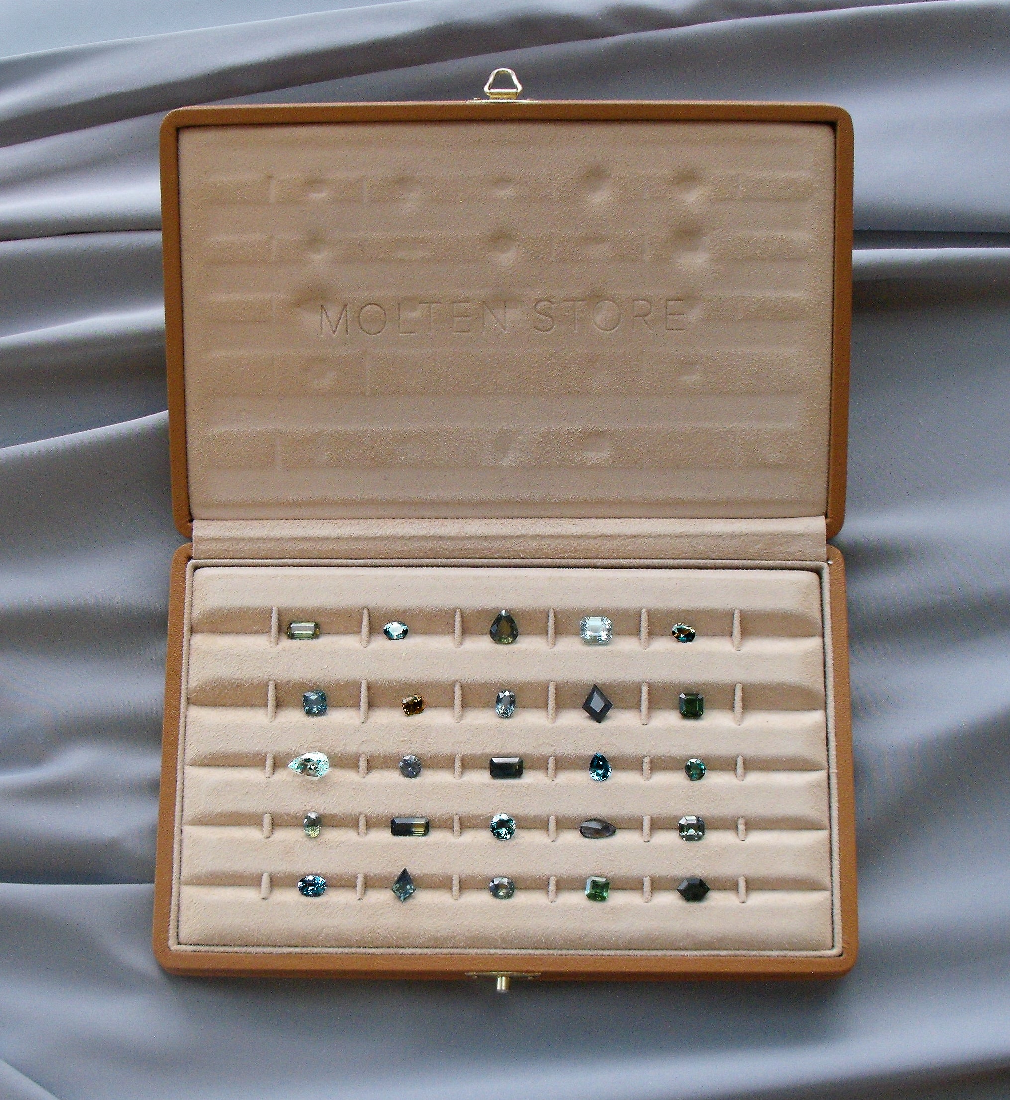 Molten-Store-Gemstones-In-Tray-on-Silk.jpg