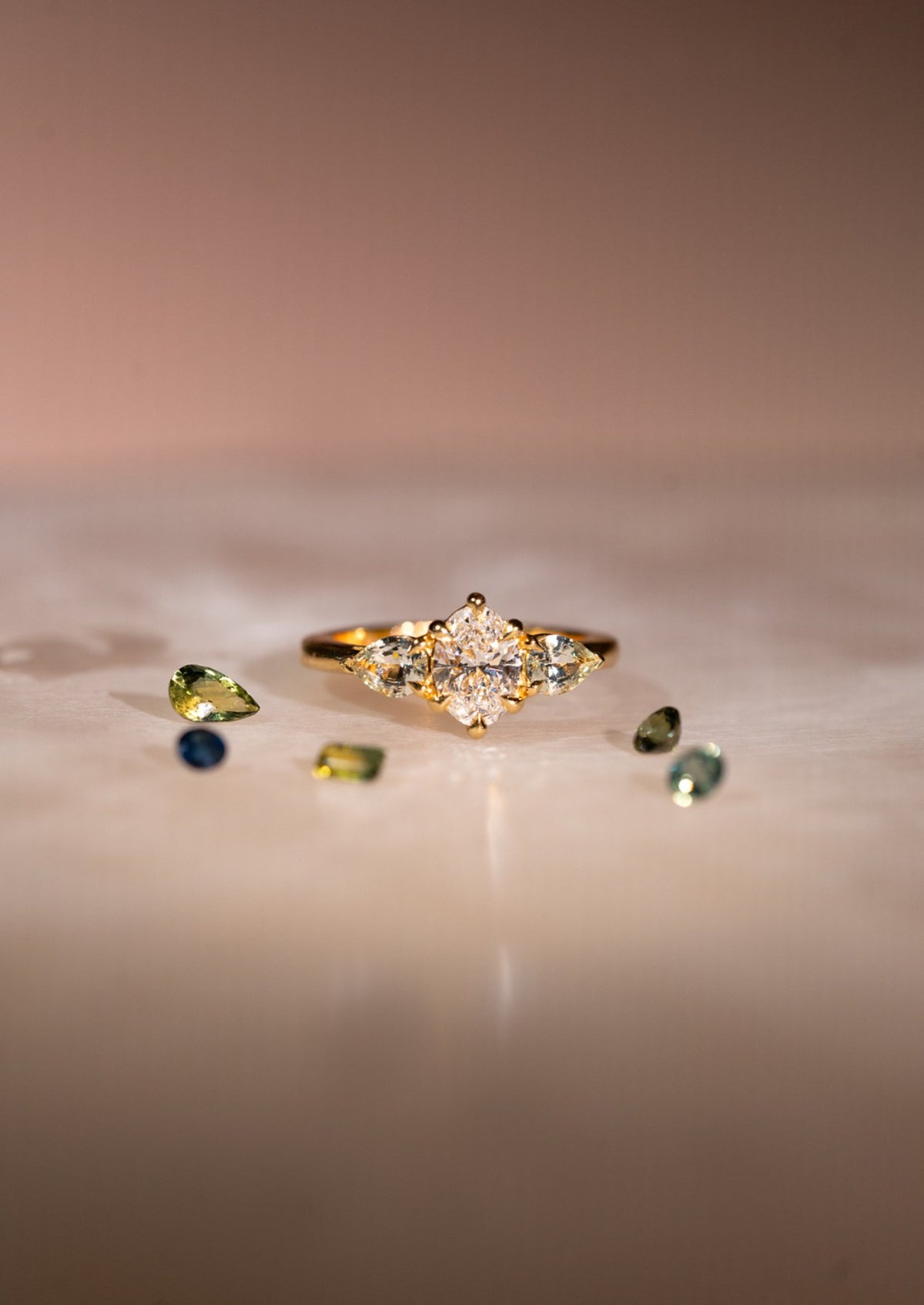The Esme Three Stone Ring with Oval Cut Diamond & Pear Cut Green Sapphires design detail