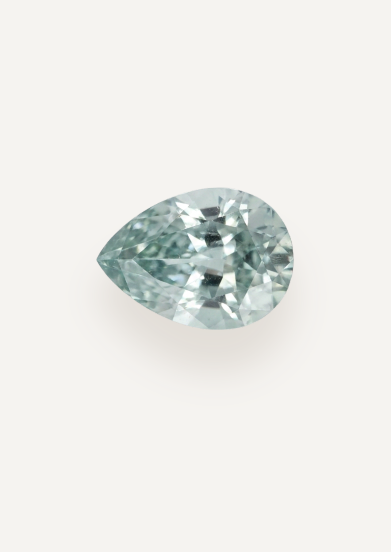Alternate face up product view showing very pale blue in a tapered drop with an airy centre.