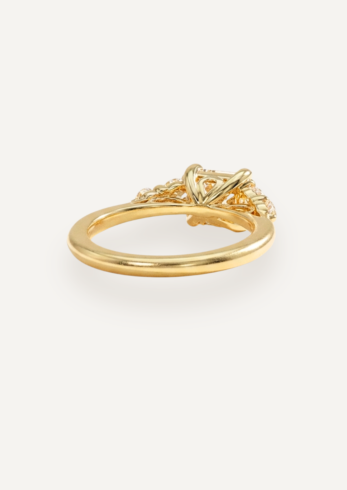 Low side view of the Vera five-stone ring, showing the centre setting and open structure