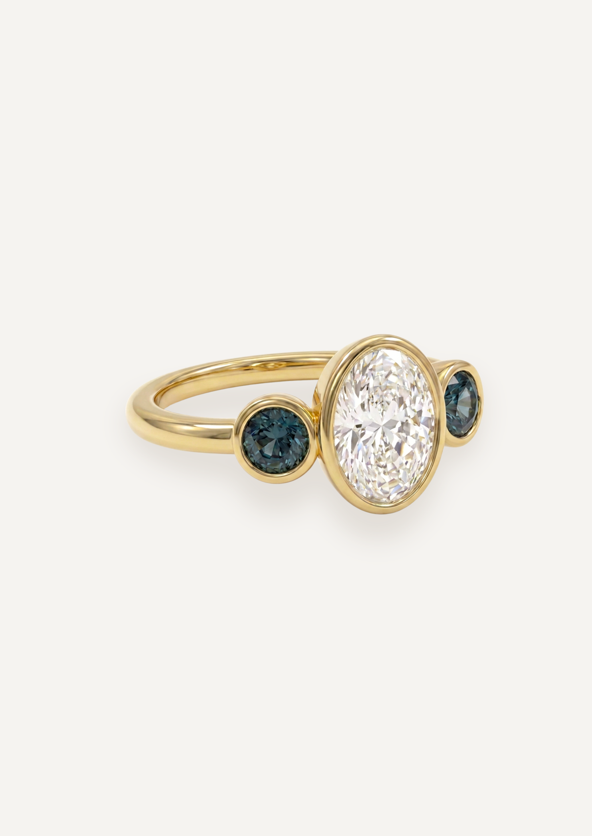 Side render of The Beatrice Ring showing the 18ct yellow gold setting with a white diamond centre and green sapphire side stones.