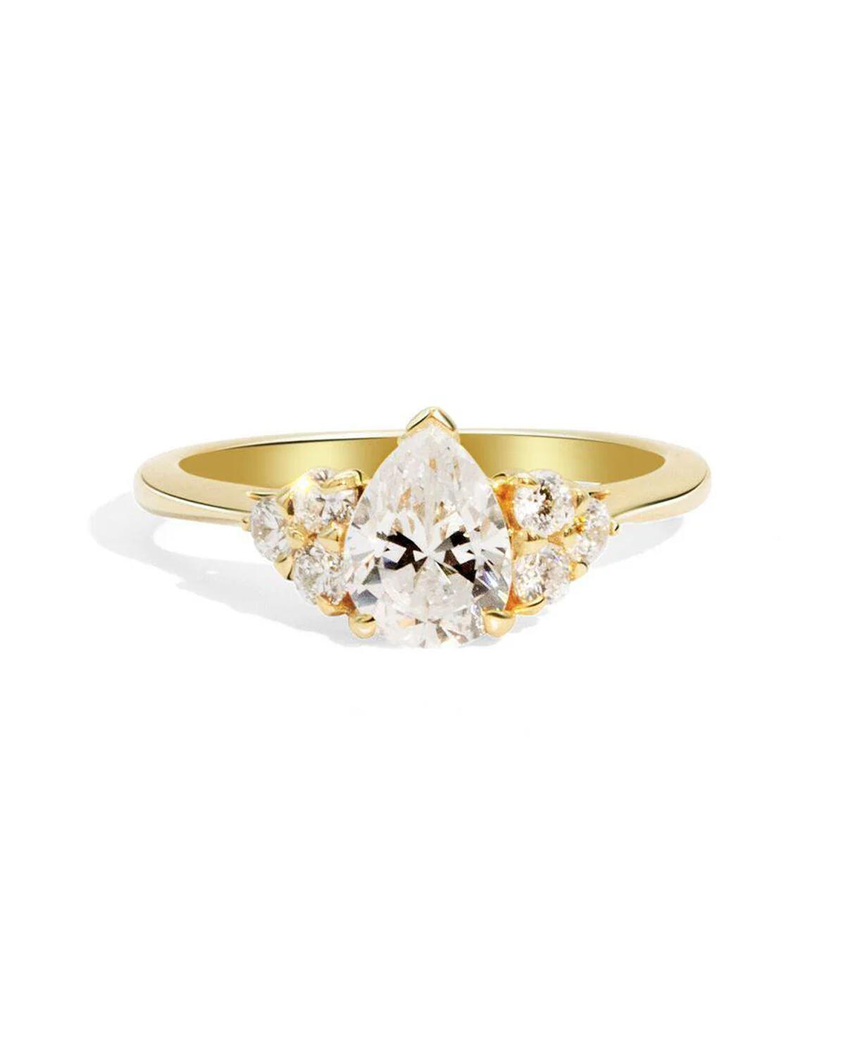 Yellow gold, white diamond, multi-stone engagement ring with four claws on the centre stone
