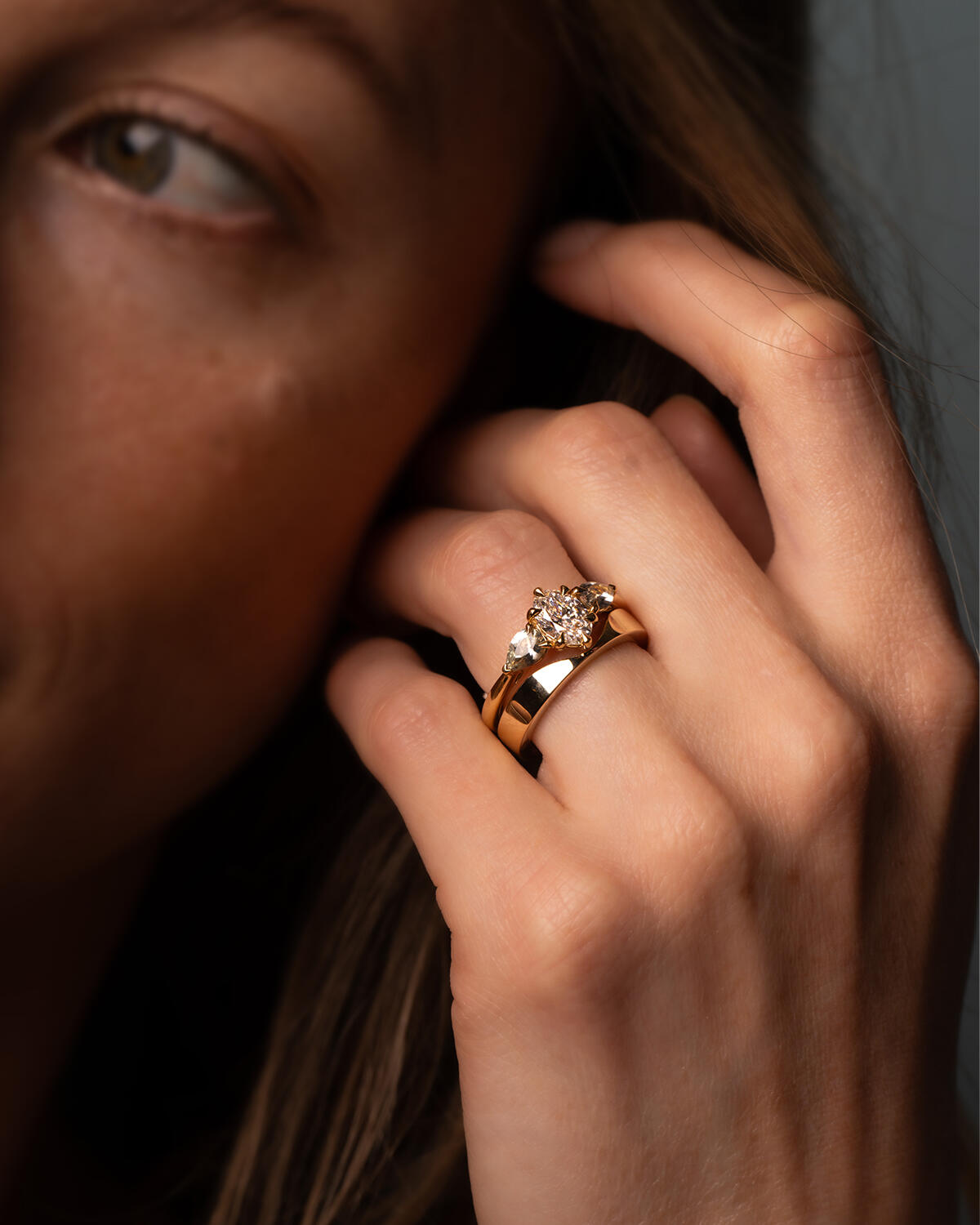 Engagement ring and wedding band on ring finger