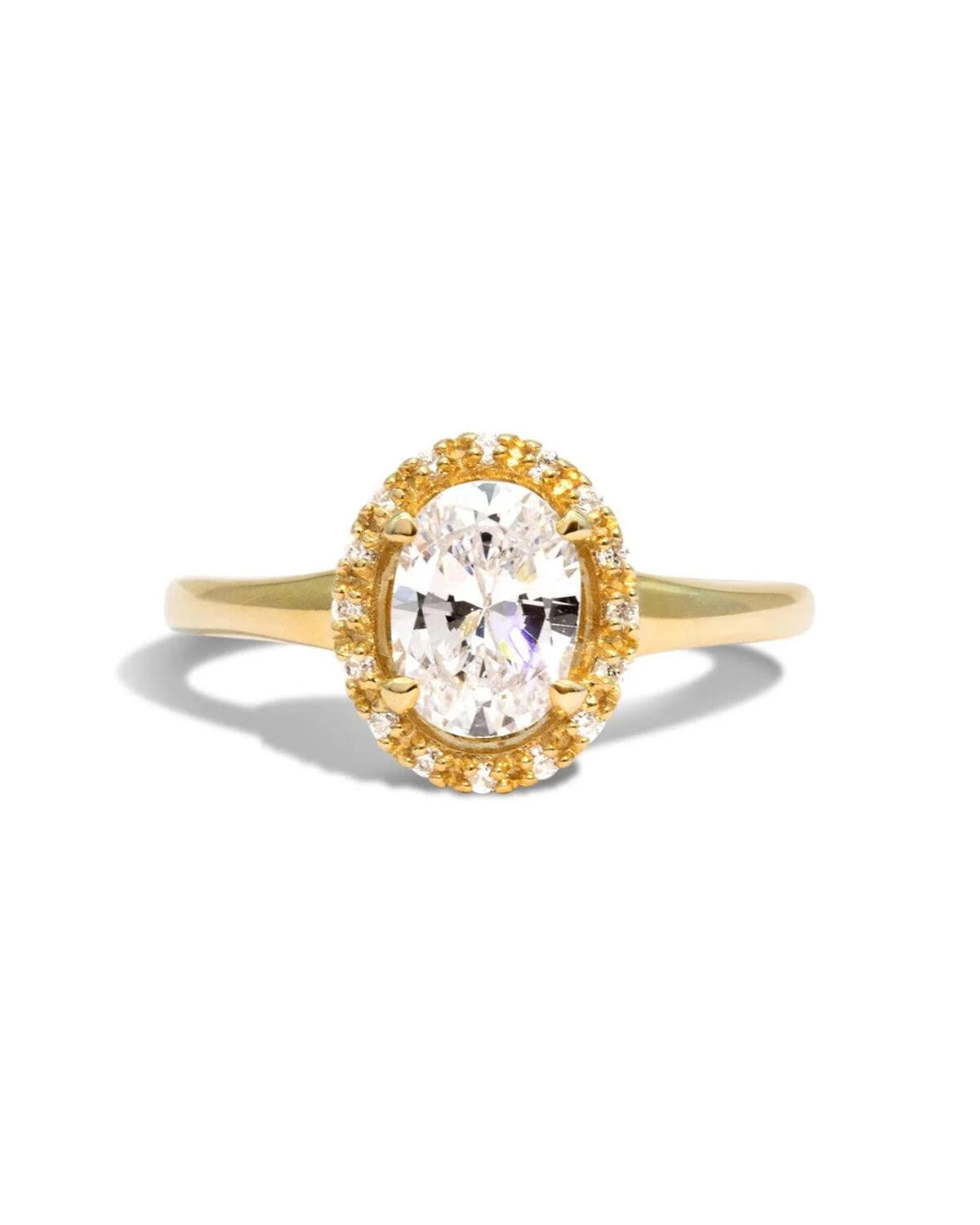 Yellow gold, white diamond engagement ring with four claws on the centre stone