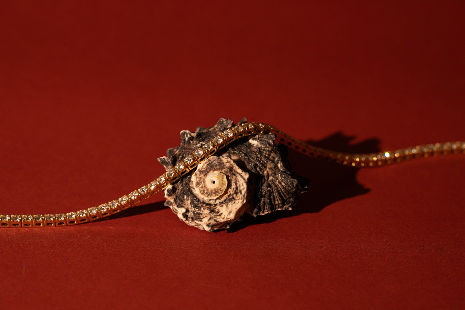 Image of an engagement ring with an oval centre stone and 3 side stones on each side scaling down