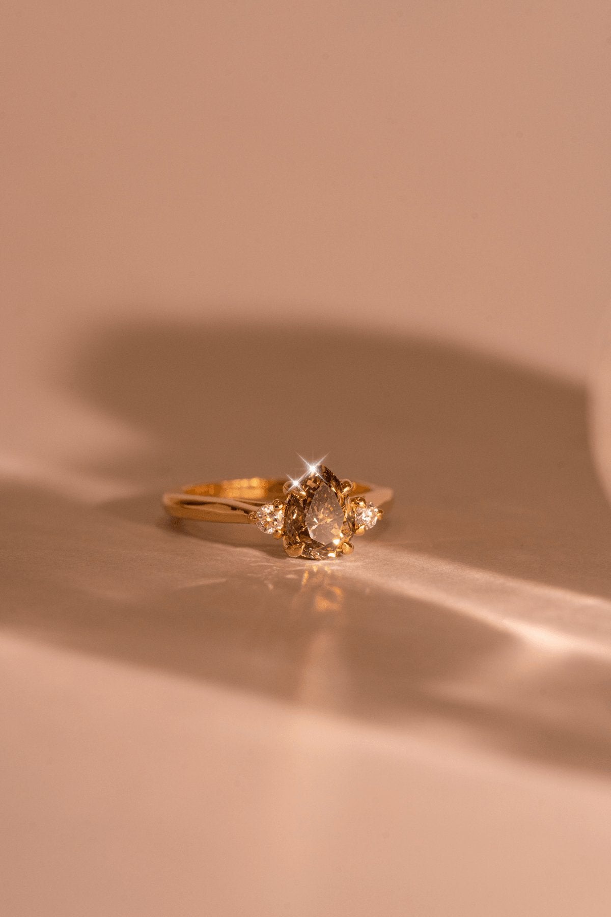 The Ada Ring with Pear Cognac Diamond & Round White Diamonds design detail