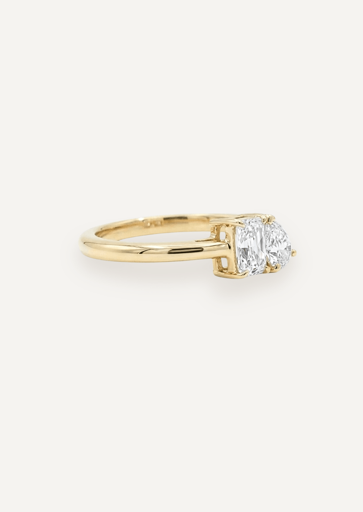 The Toi Et Moi Ring with Emerald & Pear Cut Diamond design detail